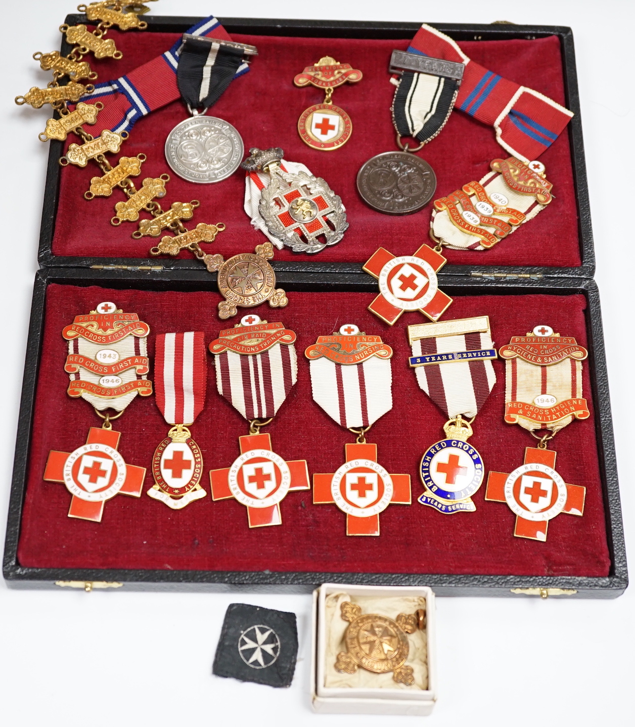 A collection of British Red Cross, etc. medals, awards and memorabilia including medals in original card boxes, a WWII medal group with miniatures including a Voluntary Medical Services Medal, proficiency in first aid me